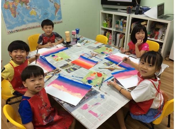 Posing for a quick photo while painting the background with various colours...