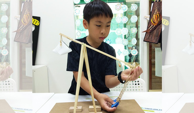 Launching a projectile with a trebuchet!