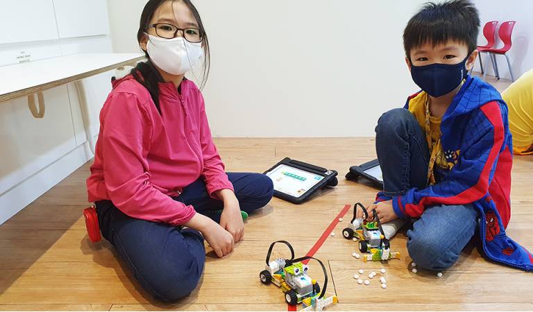 Put on your thinking caps and code and move the robot!