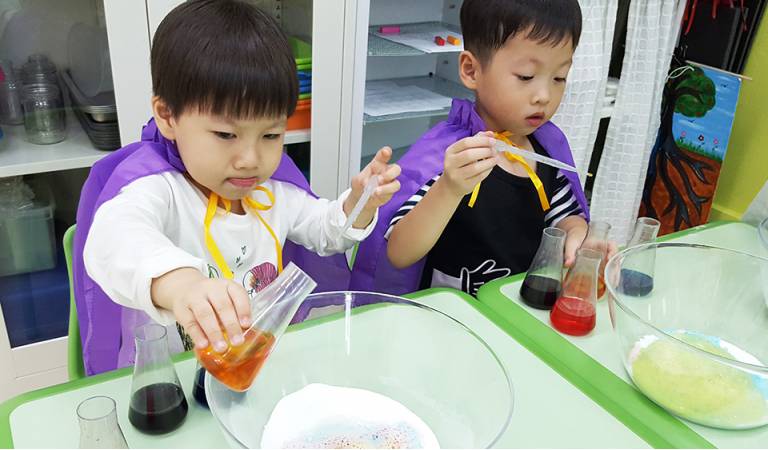 Totally focused and engrossed in the experiment!